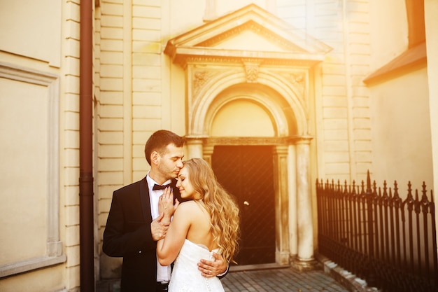 Free photo newlyweds embraced on a sunny day