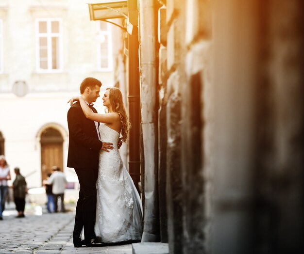 Newlyweds hugging and looking at each other