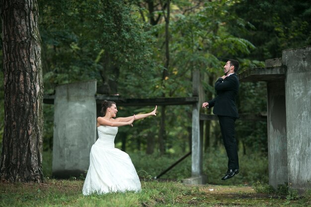 Newlyweds playing outdoors