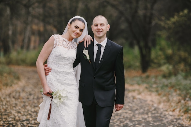 Newlyweds walking in the field