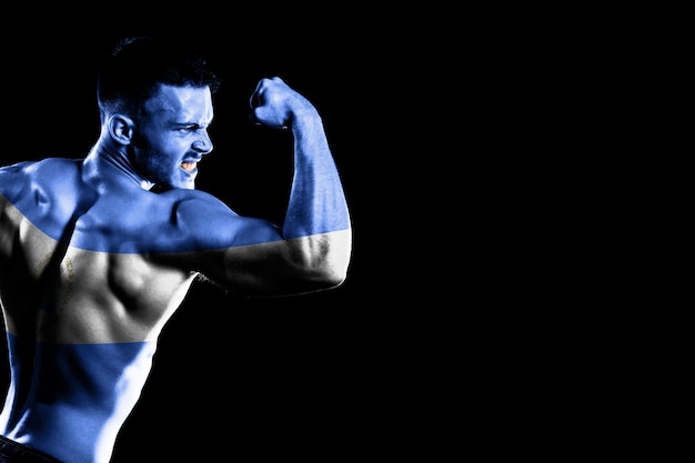 Nicaragua flag on handsome young muscular man black background
