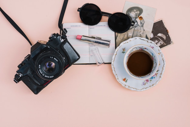 Nice accessories near camera and coffee