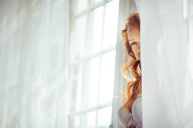 Nice portrait of beautiful and gentle bride in the morning