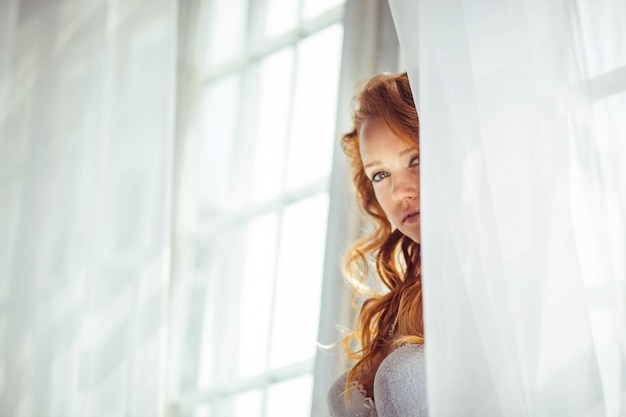 Nice portrait of beautiful and gentle bride in the morning