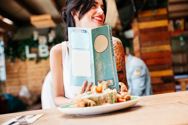 Nice woman with menu