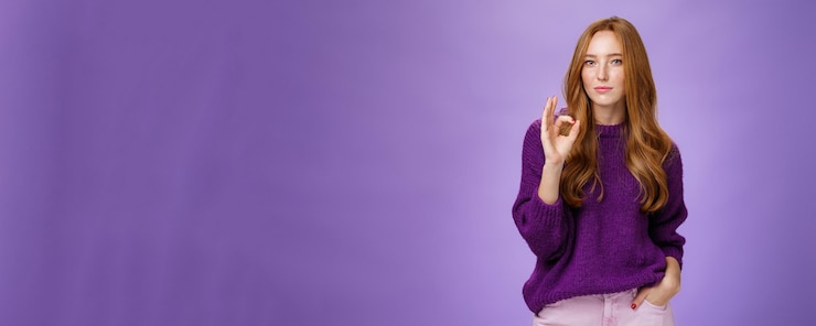 Free Photo nice work cool portrait of delighted stylish and confident goodlooking redhead female in purple swea