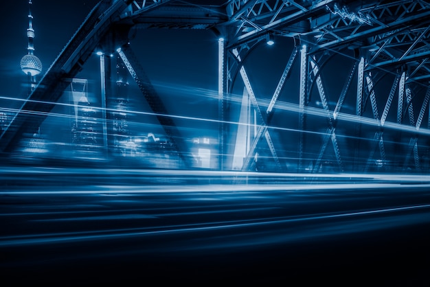 Night view of the Waibaidu Bridge in blue tone