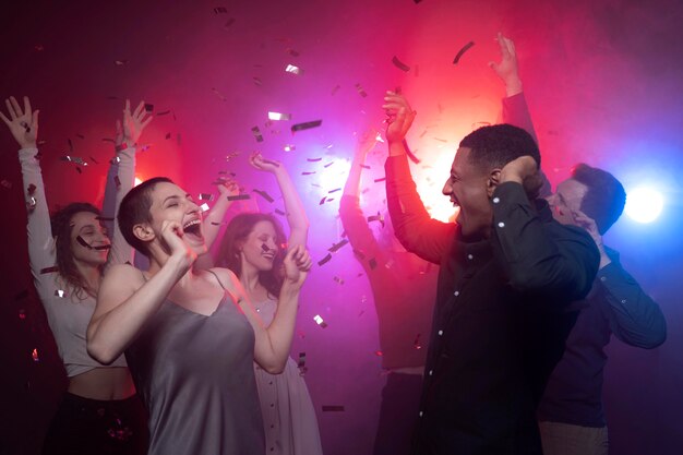 nightlife with people dancing in a club