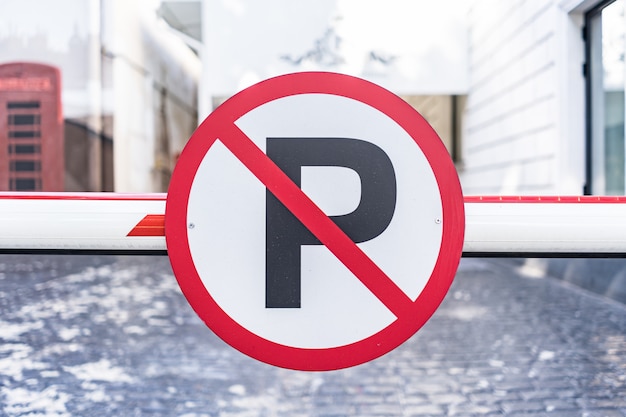 Free photo no auto parking sign bolted to barrier in the city