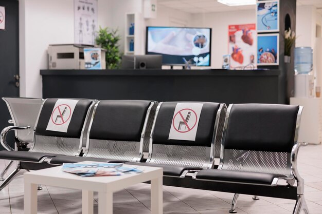 No people in empty hospital reception waiting room, medical facility with healthcare service to cure patients with disease. Nobody in clinic lobby waiting area during covid 19 pandemic.