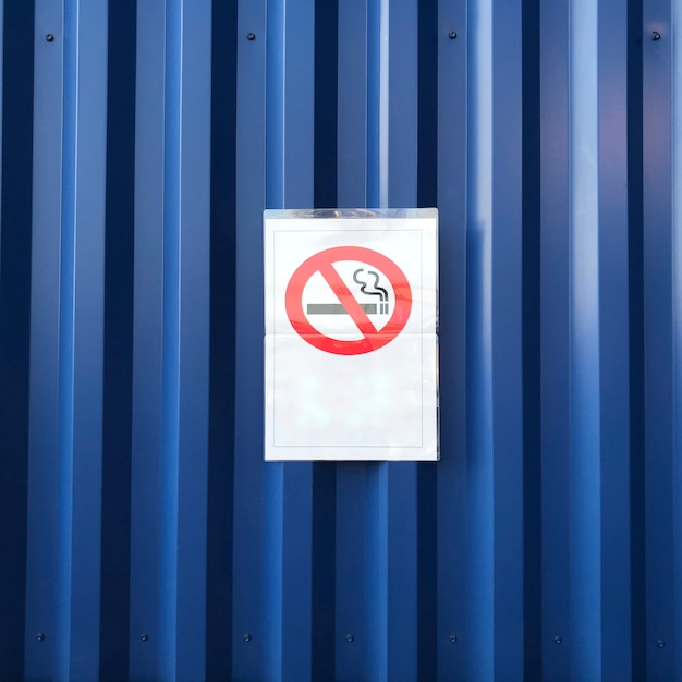 No smoking sign on blue wall