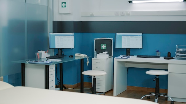 Nobody in medical cabinet used by doctor to help patients with health care at checkup visit. Empty office for consultation appointment where medic does examination to treat people.