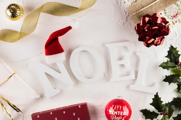 Noel inscription near Christmas decorations 