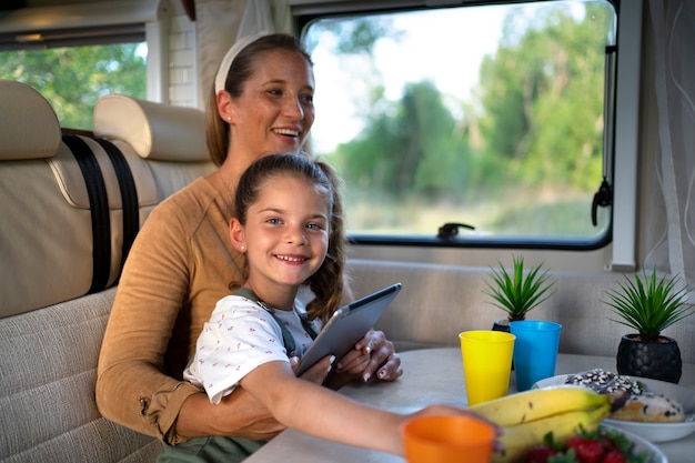 Nomad family having fun together in tiny house