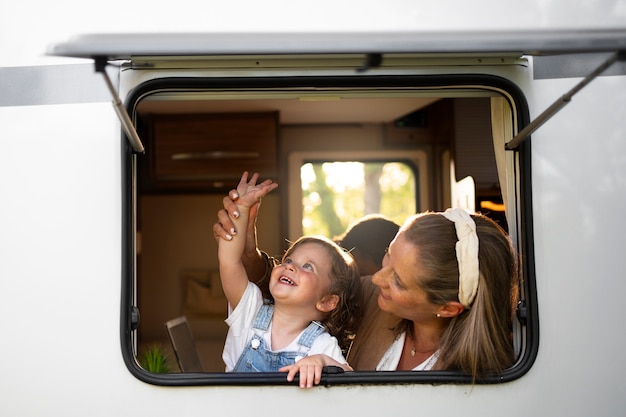 Nomad family having fun together in tiny house