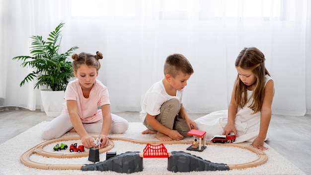 Non-binary kids playing with cars game