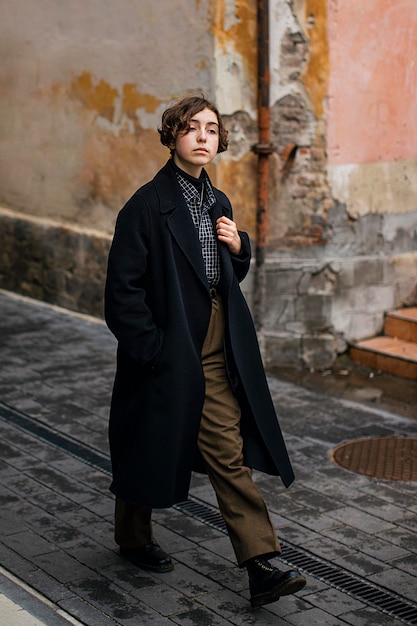 Non binary person in vintage clothes walking