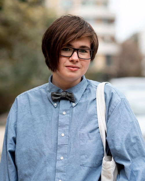 Non binary person with glasses