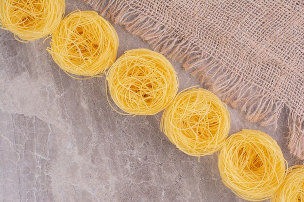 Noodle tops isolated on the marble space. 