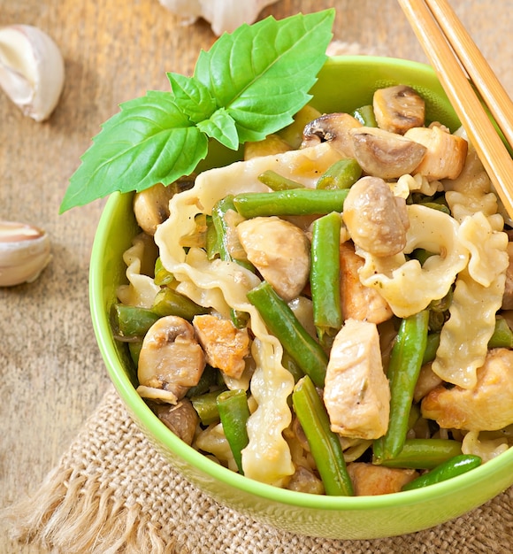 Noodles with meat, beans and mushrooms