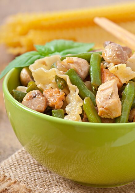 Noodles with meat, beans and mushrooms