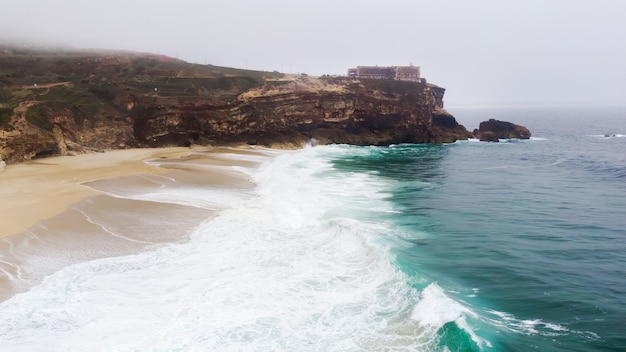 North Beach in Nazare Portugal with foaming waves