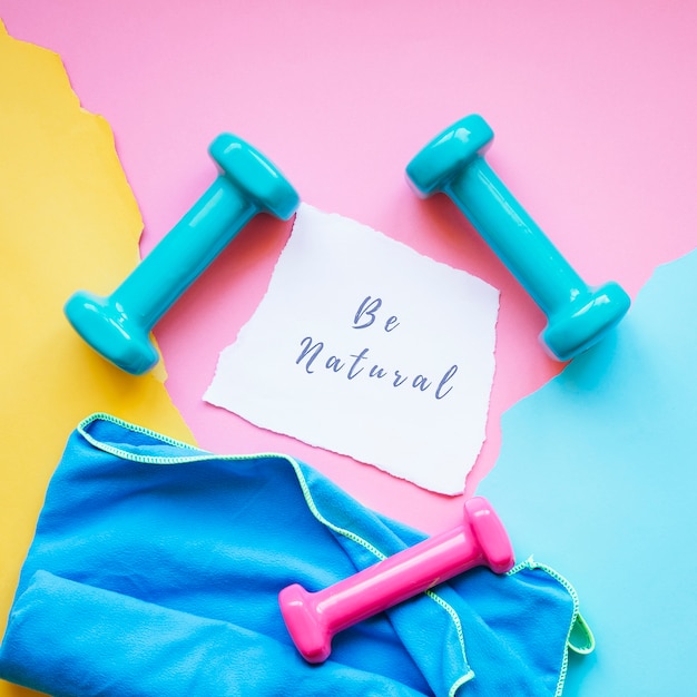 Note amidst dumbbells and towel