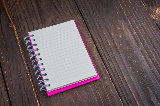 Note book on wooden background