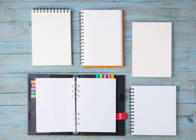 Notebook on blue wood table 