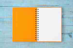 Free photo notebook on blue wood table