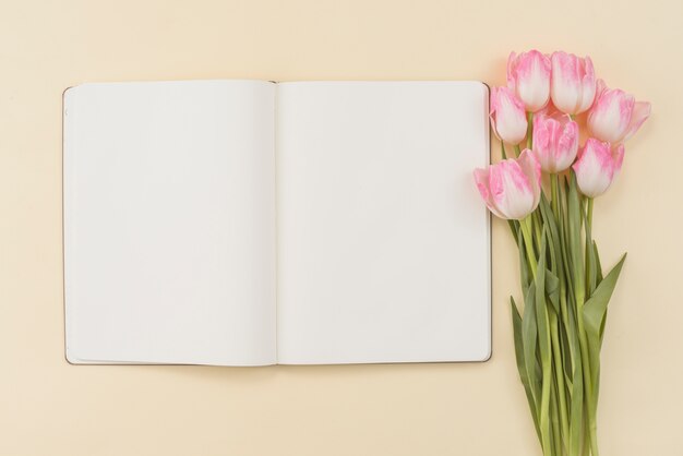Notebook and bouquet of tulips