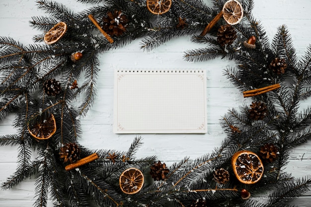 Notebook between fir branches