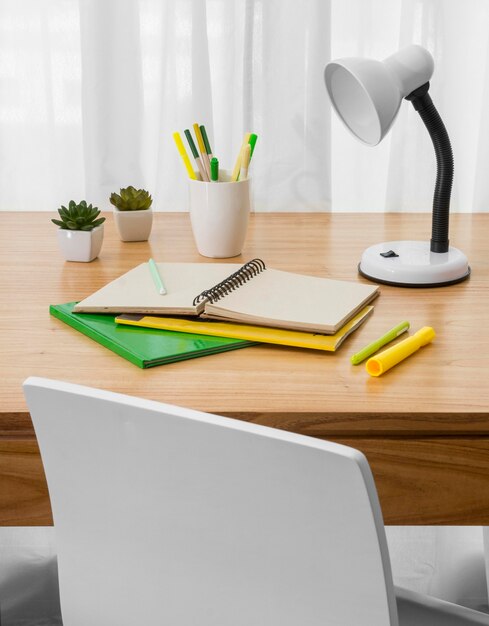 Notebook and lamp on desk