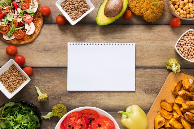 Notebook mock-up surrounded by vegan food