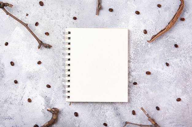 Free photo notebook mock-up with branches