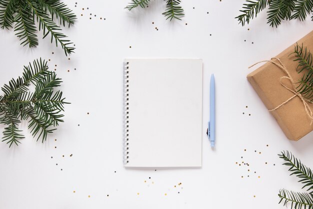 Notebook mock-up with pine branches