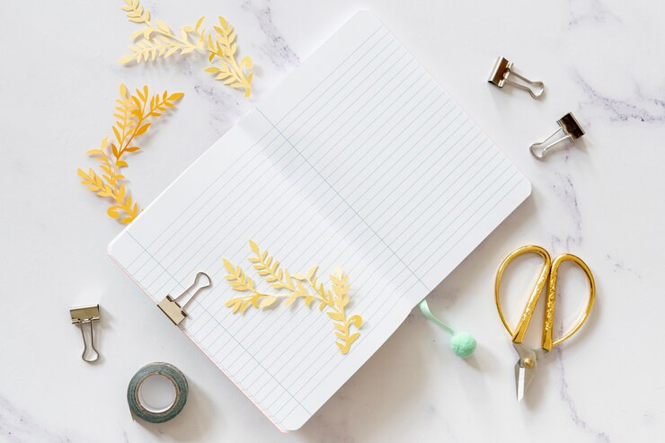 Free Photo notebook mock-up with scissors top view