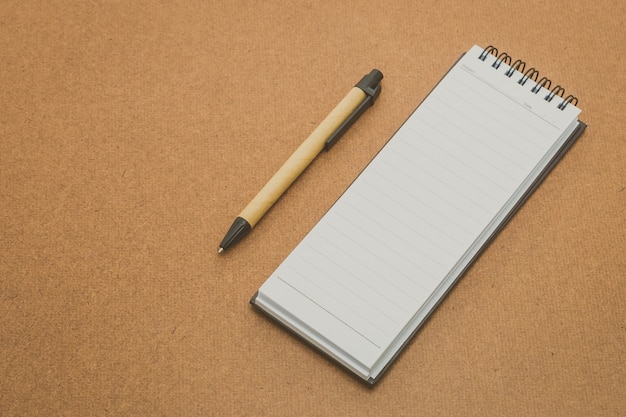 Notebook mock up on wood background