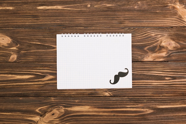 Notebook and ornamental mustache