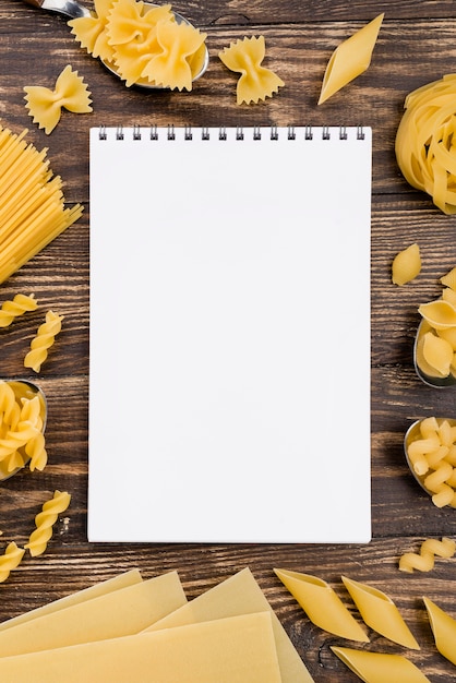 Free photo notebook and pasta