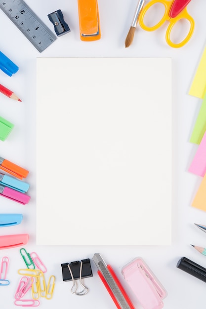 Free photo notebook and school or office tools  on white background and