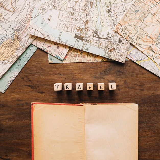 Notebook and travel writing near maps