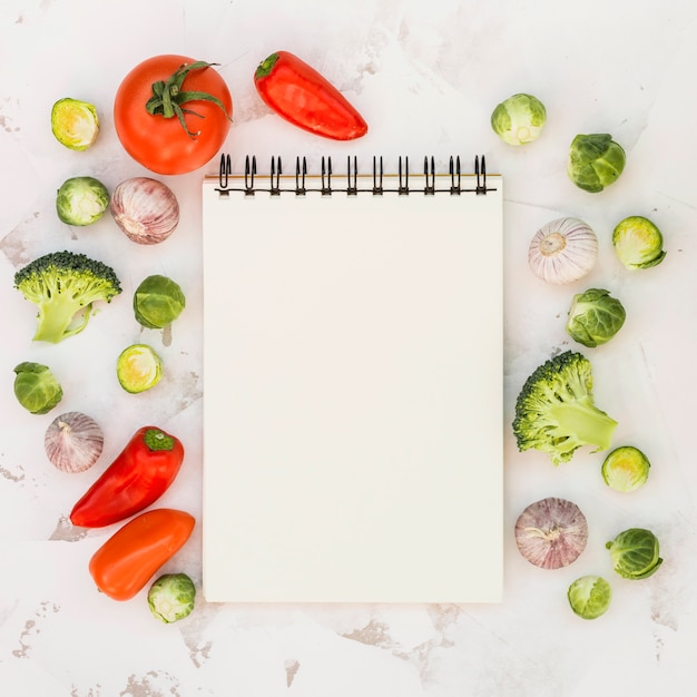 Notebook and vegetables