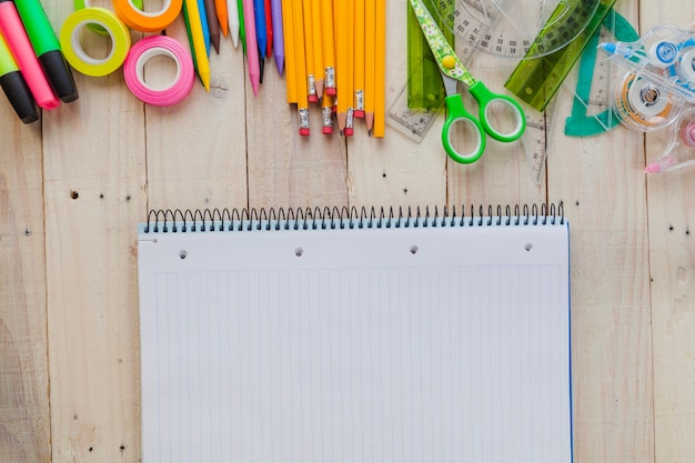 Free photo notebook and vivid composition of stationery