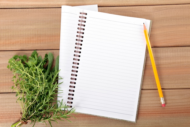 Notebook with a bunch of herbs