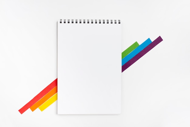 Notebook with colorful paper pieces