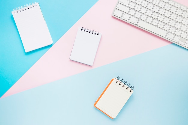 Notebooks on cute desktop with keypad