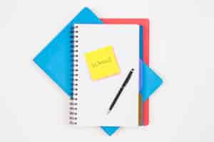 Free photo notebooks pen and paper reminder with the word school