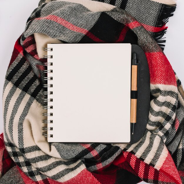 Notepad on checkered scarf