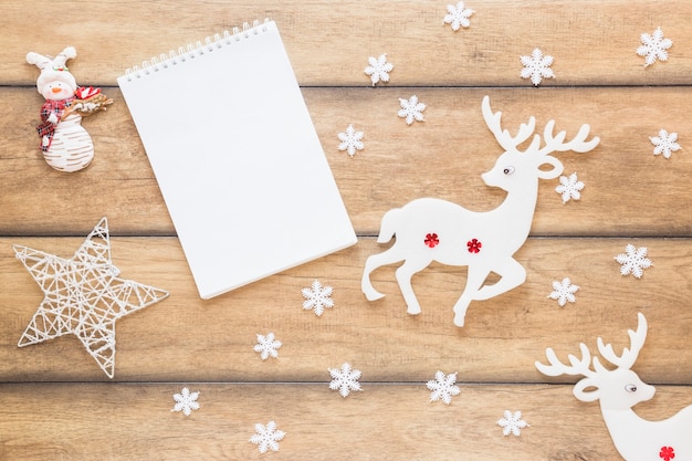 Notepad between decorative deer and star